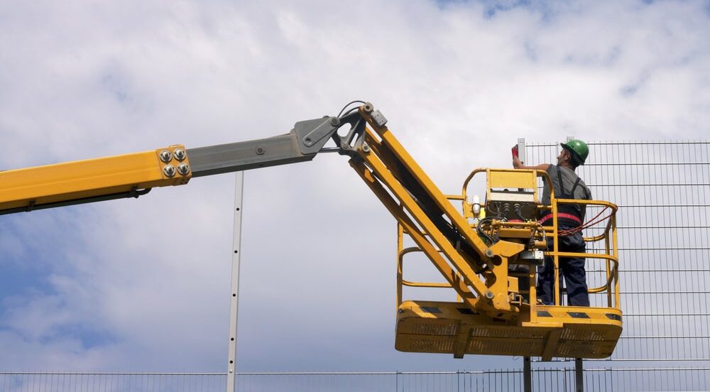 Workers on scissor lift platform